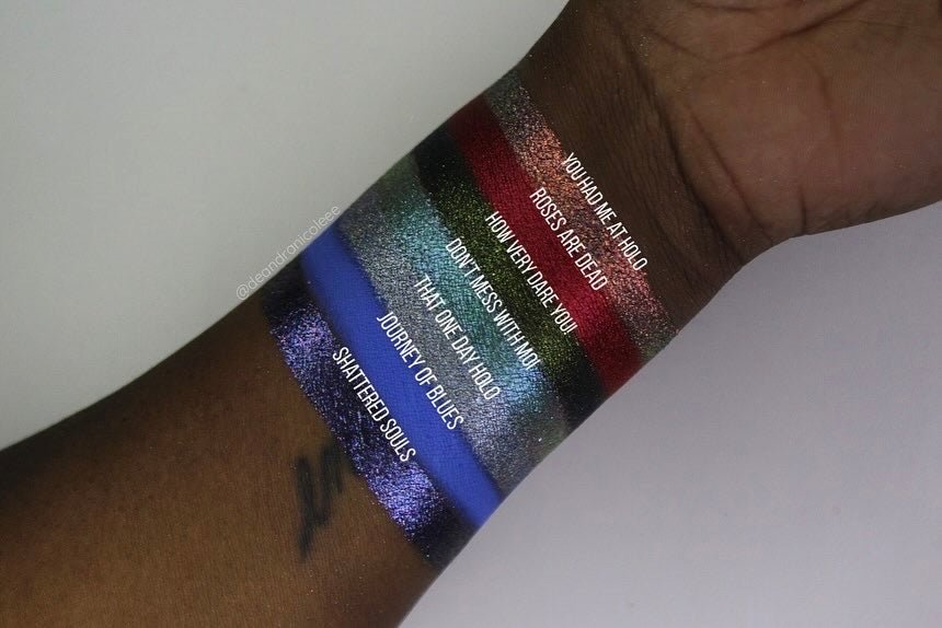 Dark skin swatches of That one day holo  icy blue silver base packed with rainbow holographic pigment with prism effect